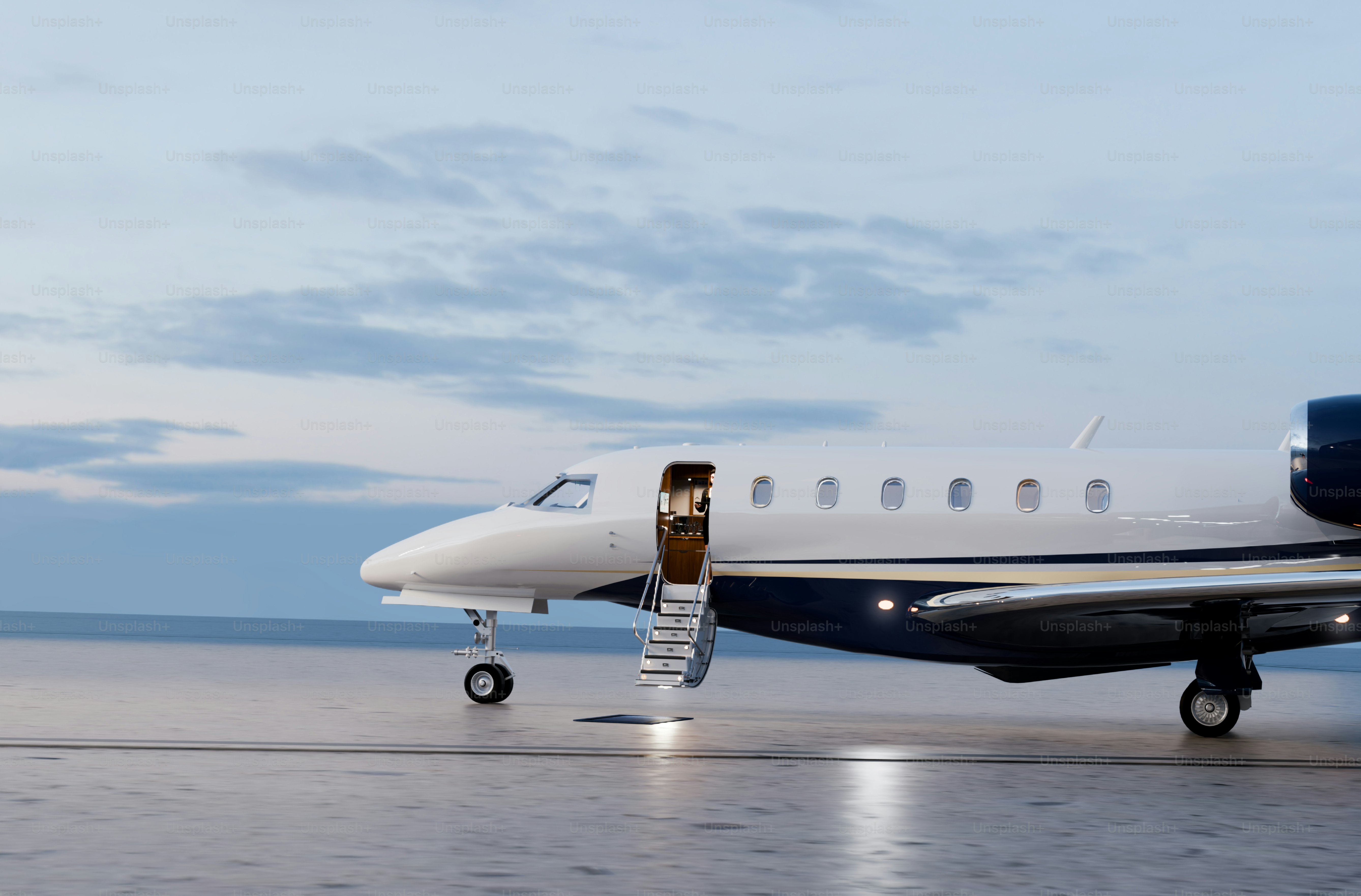Private jet with open door on tarmac